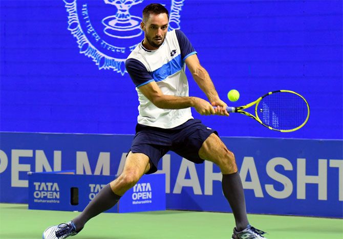 Serbia's Vicktor Troicki in action against India's Sumit Nagal in the opening round of the men's singles at the Tata Open Maharashtra, in Pune, on Monday.