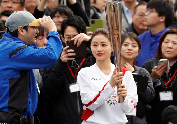 The opening ceremony of the torch relay would also be held without spectators, Kyodo said.