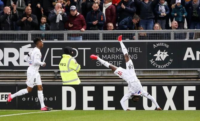 Fousseni Diabate celebrates scoring Amiens's third goal.