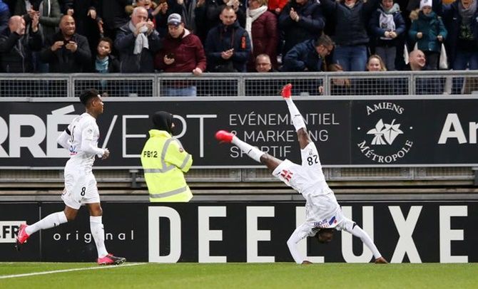 Fousseni Diabate celebrates scoring Amiens's third goal.