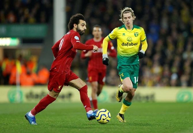 Liverpool's Mohamed Salah makes his way past Norwich City's Todd Cantwell.