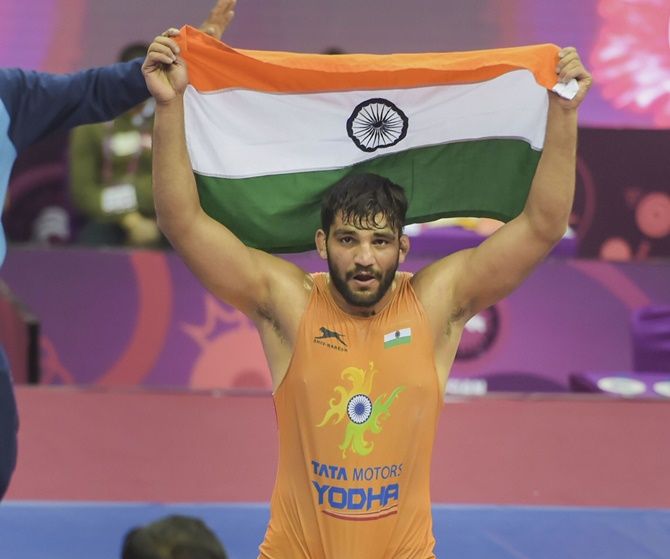 India’s Sunil Kumar celebrates with the tricolour after defeating Azat Salidinov of Kyrgyzstan in the 87kg Greco-Roman final in the Asian Wrestling Championships, in New Delhi, on Tuesday