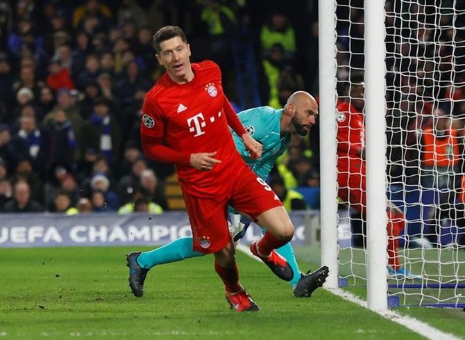 Robert Lewandowski scores Bayern Munich's third goal and launches into his celebratory run.