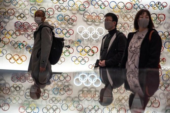 People walk through the Japan Olympics museum in Tokyo, Japan. 