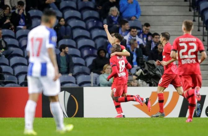 Kai Havertz celebrates scoring Bayer Leverkusen's third goal with Moussa Diaby and teammates