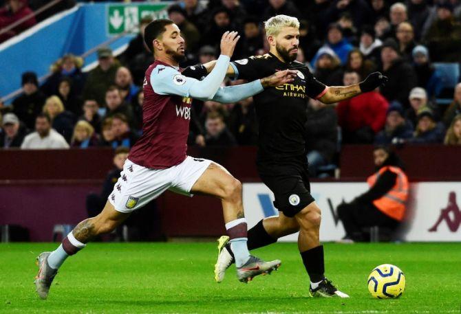 Manchester City's Sergio Aguero in action with Aston Villa's Douglas Luiz during their English Premier League match on Sunda