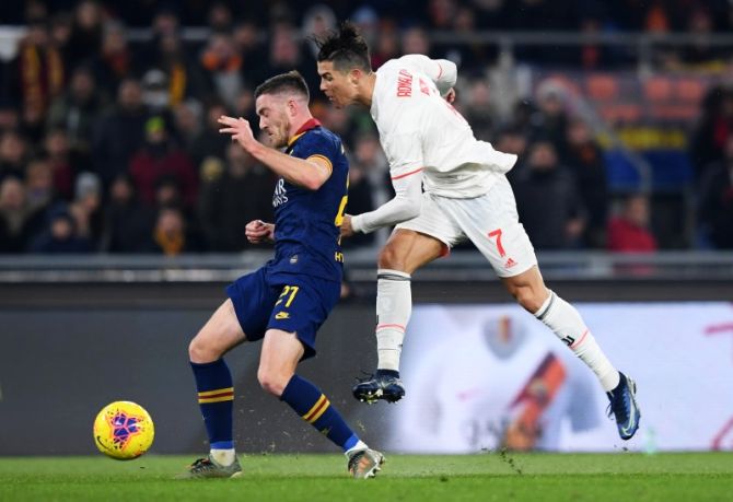 Juventus' Cristiano Ronaldo vies with AS Roma's Jordan Veretout during their Serie A match at Stadio Olimpico, Rome, Italy on Sunday 