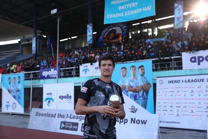 Danillo Augusto, Punjab's Brazilian defender, with the Hero of the Match award.