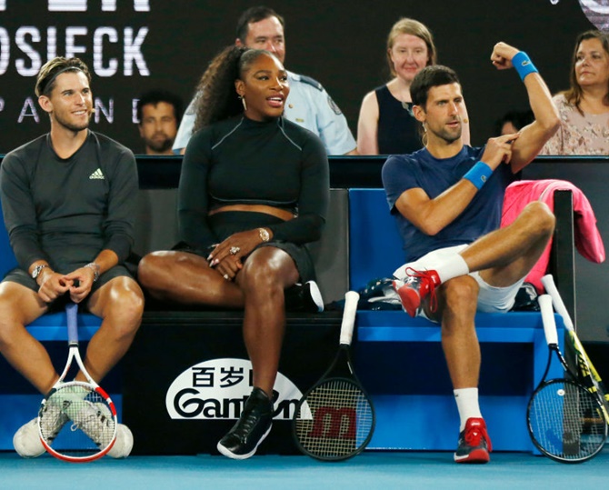 Novak Djokovic, right, with Serena Williams and Dominic Thiem during the Rally for Relief Bushfire appeal in Jan 2020. Novak Djokovic, right, gestures during the Rally for Relief Bushfire appeal 