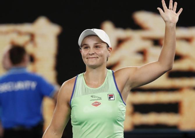 Australia's Ashleigh Barty celebrates after winning her first round match against Ukraine's Lesia Tsurenko at the Australian Open in Melbourne on Monday