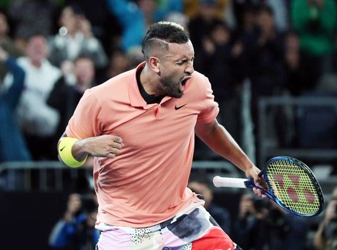 Australia's Nick Kyrgios celebrates victory over France's Gilles Simon in the second round