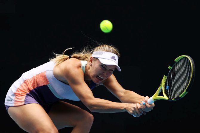 Denmark's Caroline Wozniacki stretches to play a backhand during her third round match against Tunisia's Ons Jabeur