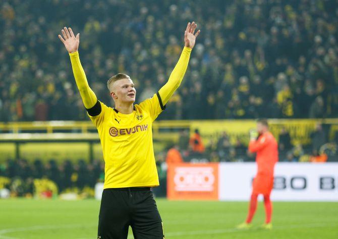 Borussia Dortmund's Erling Braut Haaland celebrates scoring their fifth goal against FC Cologne in their Bundesliga match at Signal Iduna Park in Dortmund on Friday