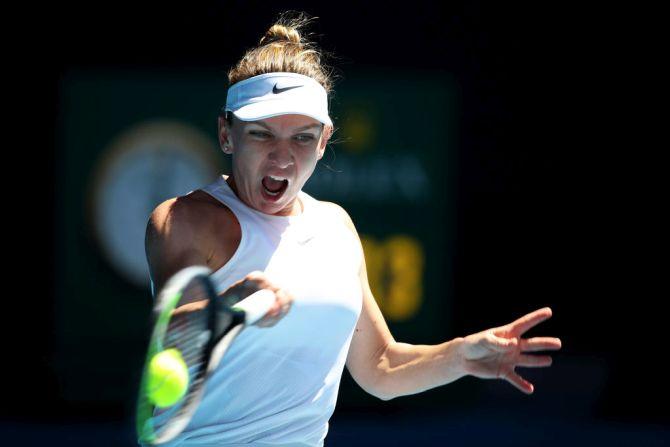 Romania's Simona Halep plays a forehand return against Kazakhstan's Yulia Putintseva during their third round match