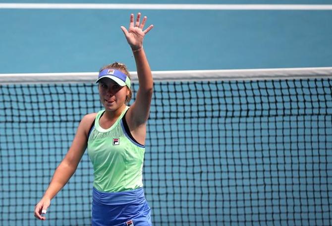 Sofia Kenin of the United States waves to fans as she celebrates winning her fourth match against Cori Gauff 