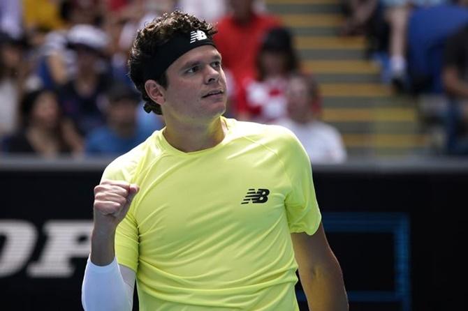 Canada's Milos Raonic celebrates winning his third round match against Croatia's Marin Cilic at the Australian Open on Sunday