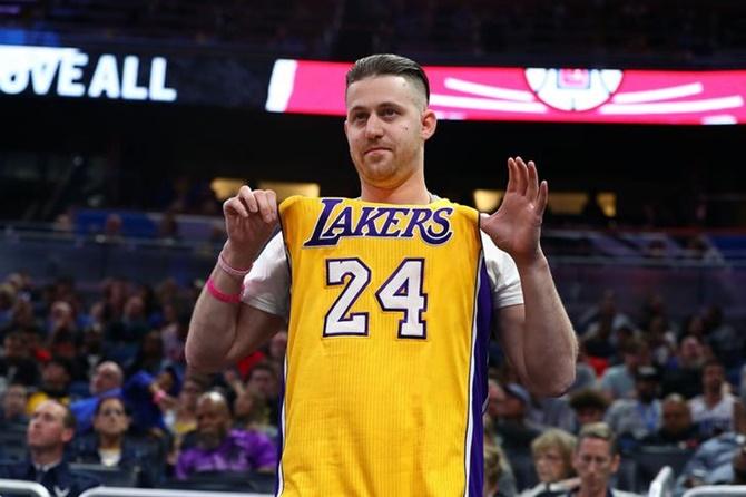 A Los Angeles fan wears the jersey in remembrance of the late Los Angeles Lakers former player Kobe Bryant (24) during the first quarter between the LA Clippers and Orlando Magic at Amway Center.