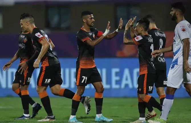 Goa FC players celebrate after Jackichand (No. 10) scores in Wednesday's ISL match against Odisha FC