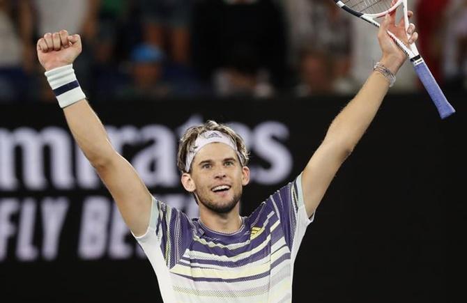 Austria's Dominic Thiem celebrates victory over Germany's Alexander Zverev in the men's singles semi-final at the Australian Open, in Mebourne, on Friday