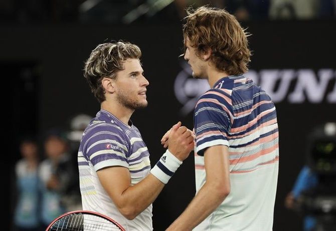 Dominic Thiem, left, and Alexander Zverev embrace after the match.