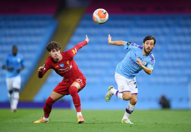  Liverpool's Neco Williams and Manchester City's Bernardo Silva vie for possession during their EPL match at the Etihad Stadium in Manchester on Thursday