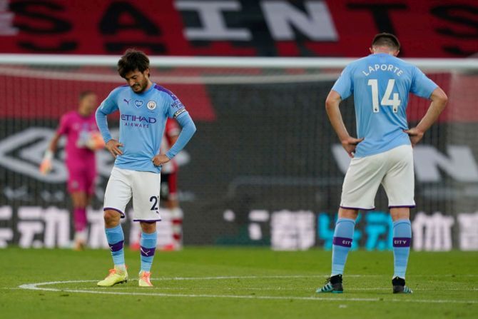 Manchester City's David Silva and Aymeric Laporte look dejected after Southampton FC take the lead during their English Premier League match at St Mary's Stadium in Southampton on Sunday