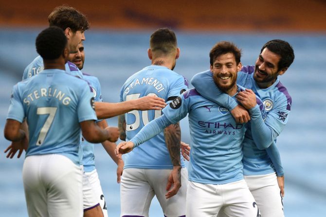 Manchester City's David Silva celebrates with his team after converting a free kick against Newcastle United at Etihad Stadium in Manchester