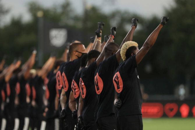 Players of MLS teams Orlando City and Inter Miami participate in a Black Lives Matter pre-game ceremony before match between as part of MLS is back Tournament at ESPN Wide World of Sports Complex in Reunion, Florida on Wednesday.