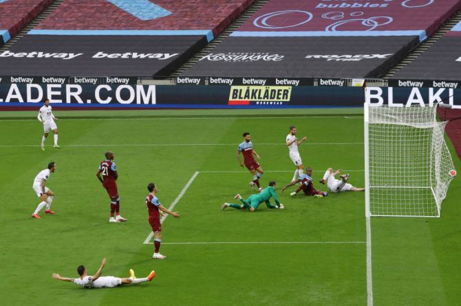 Burnley's Chris Wood (right) scores but the goal was ruled out as offside by VAR during the match against West Ham United at London Stadium in London.