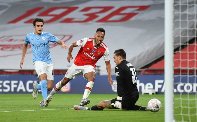 Arsenal's Pierre-Emerick Aubameyang scores against Manchester City during their FA semi-final at Wembley Stadium in London on Saturday