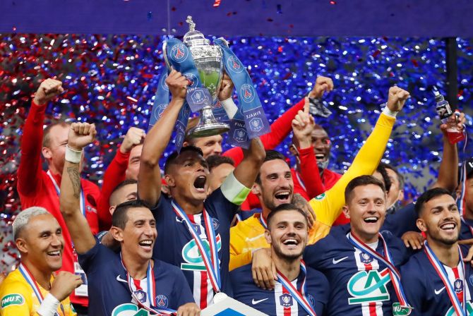 Paris St Germain's captain Thiago Silva and teammates celebrate with the trophy after winning the Coupe de France on Friday 