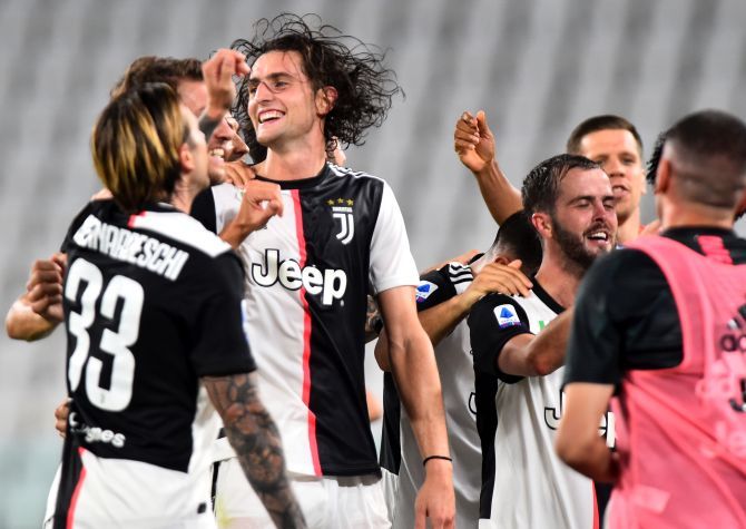 Juventus' Adrien Rabiot celebrates with teammates after winning the match and the Serie A title