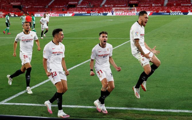Sevilla's Lucas Ocampos celebrates scoring their first goal against Real Betis at Ramon Sanchez Pizjuan, Seville, Spain as La Liga returns post the enforced break due to COVID-19 pandemic.