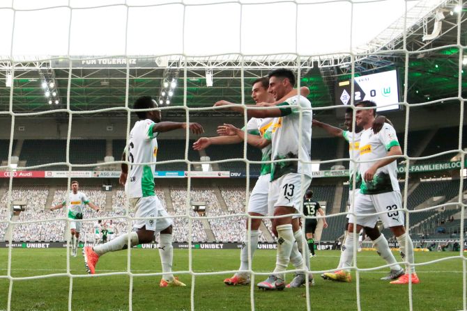 Borussia Moenchengladbach's Lars Stindl celebrates with teammates on scoring their third goal against VfL Wolfsburg at Borussia-Park, Moenchengladbach on Tuesday