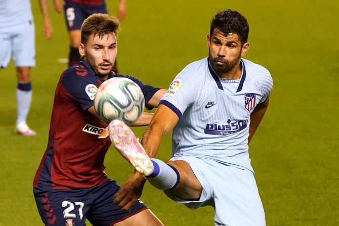 Atletico Madrid's Diego Costa in action with Osasuna's Jon Moncayola during their La Liga match at El Sadar Stadium, Pamplona, on Wednesday 