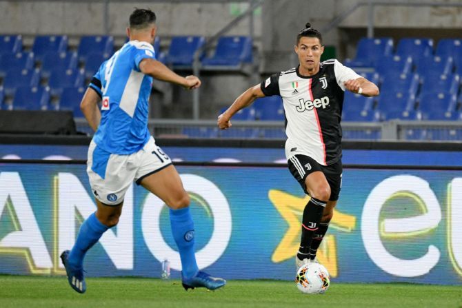 Juventus' Cristiano Ronaldo competes for the ball with SSC Napoli's Nicola Maksimovic