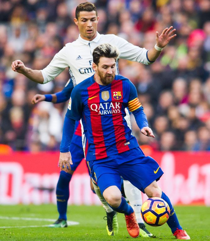Real Madrid's Cristiano Ronaldo and Lionel Messi of Barcelona in action during the La Liga match at Camp Nou in Barcelona, on December 3 , 2016