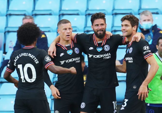 Chelsea's Olivier Giroud celebrates with teammates on scoring the winning goal against Aston Villa at Villa Park, Birmingham