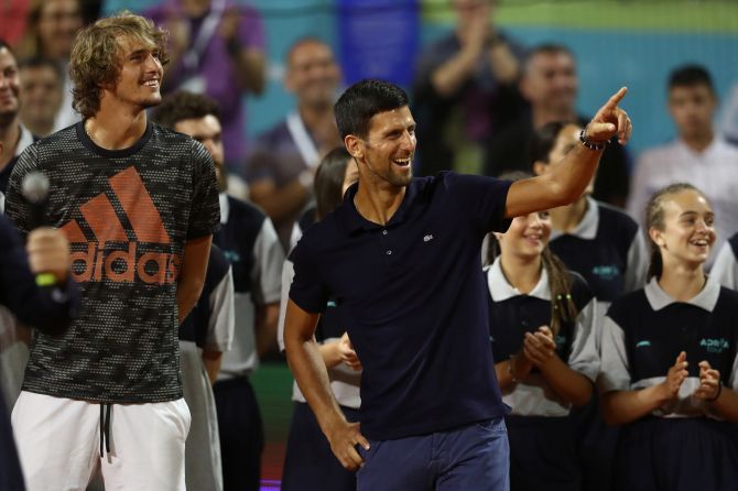 Serbia's Novak Djokovic and Germany's Alexander Zverev joke about after the Adria Tour final match, of the Serbia leg of the exhibition tournament, between Austria's Dominic Thiem and Serbia's Filip Krajinovic on Jube 14