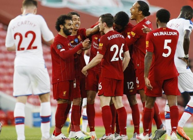 Liverpool's Fabinho celebrates scoring their third goal with teammates against Crystal Palace on Wednesday