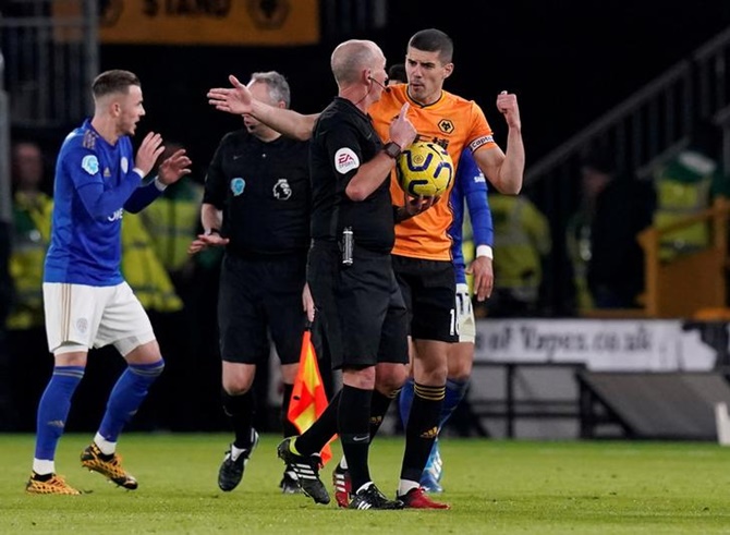 Wolverhampton Wanderers's Conor Coady remonstrates with referee Mike Dean after their goal is disallowed for off-side during their Premier League match.