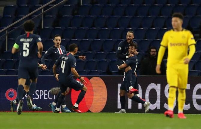 Juan Bernat celebrates scoring Paris St Germain's second goal with Neymar and teammates.