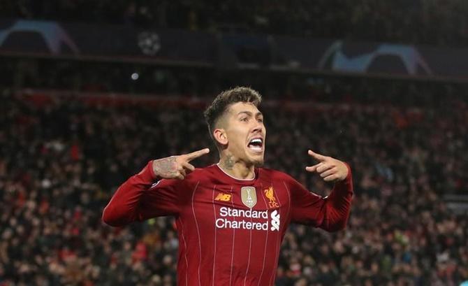 Roberto Firmino celebrates scoring Liverpool's second goal.