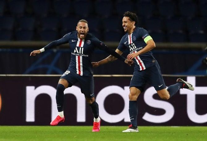 Neymar celebrates scoring Paris St Germain's first goal with Marquinhos during  the Champions League Round of 16 second leg match against Borussia Dortmund