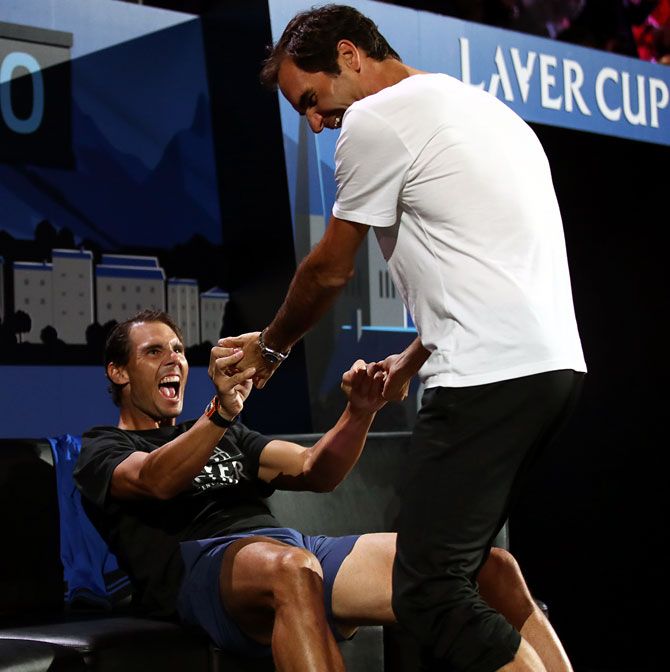 Roger Federer and Rafael Nadal of Team Europe celebrate winning a match against Team World during the 2019 Laver Cup in Geneva.