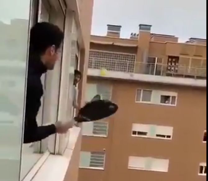In this video posted on Twitter, people in Italy are seen playing tennis in their balconies during a lockdown last week