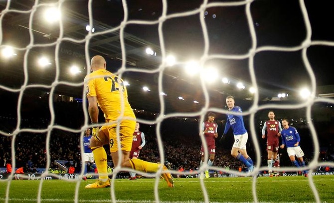Leicester City's Jamie Vardy gestures at Aston Villa goalkeeper Pepe Reina as he celebrates scoring.