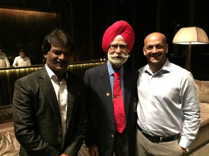 Balbir Singh Sr is flanked by Dhanraj Pillai (left) and Viren Raquinha (right)