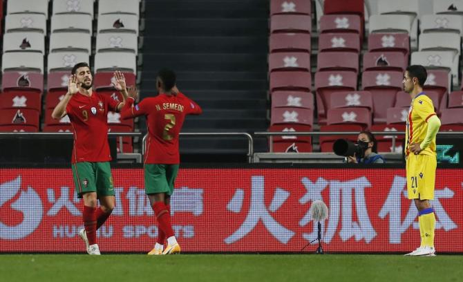 Portugal's Paulinho celebrates scoring their second goal with Nelson Semedo during their international friendly against Andorra at Estadio da Luz stadium in Lisbon