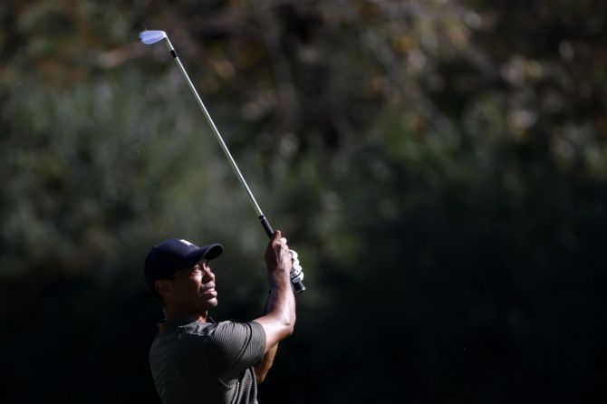 Tiger Woods on the 12th tee during the first round of the Augusta Masters at the Augusta National Golf Club. Woods began on the back nine three hours later than scheduled but seemed unbothered as he birdied the 13th and 15th holes.